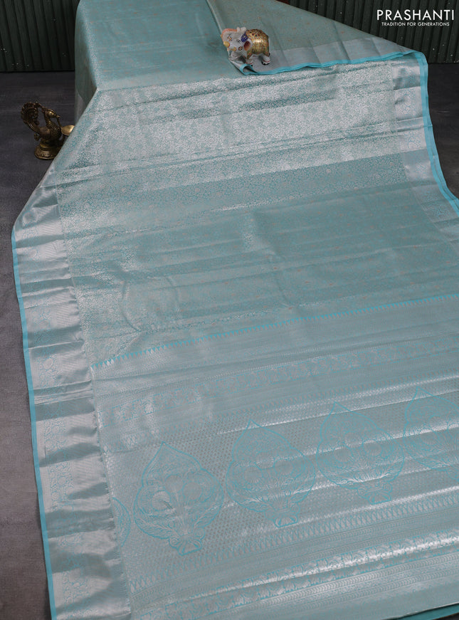 Bangalori tissue silk saree teal blue with allover zari woven brocade weaves and long zari woven border