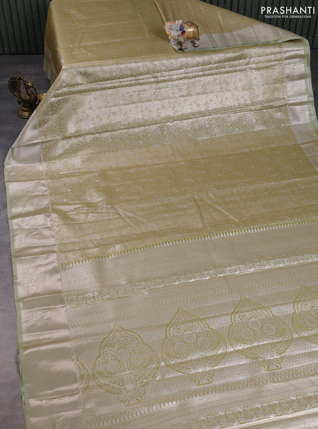 Bangalori tissue silk saree mehendi green with allover zari woven brocade weaves and long zari woven border