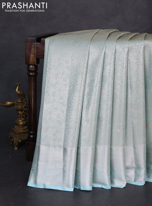 Bangalori tissue silk saree teal blue with allover zari woven brocade weaves and zari woven border
