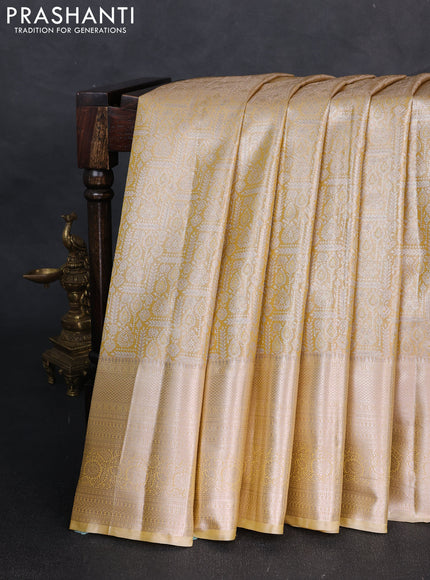 Bangalori tissue silk saree mustard yellow and pale yellow with allover zari woven brocade weaves and long zari woven border