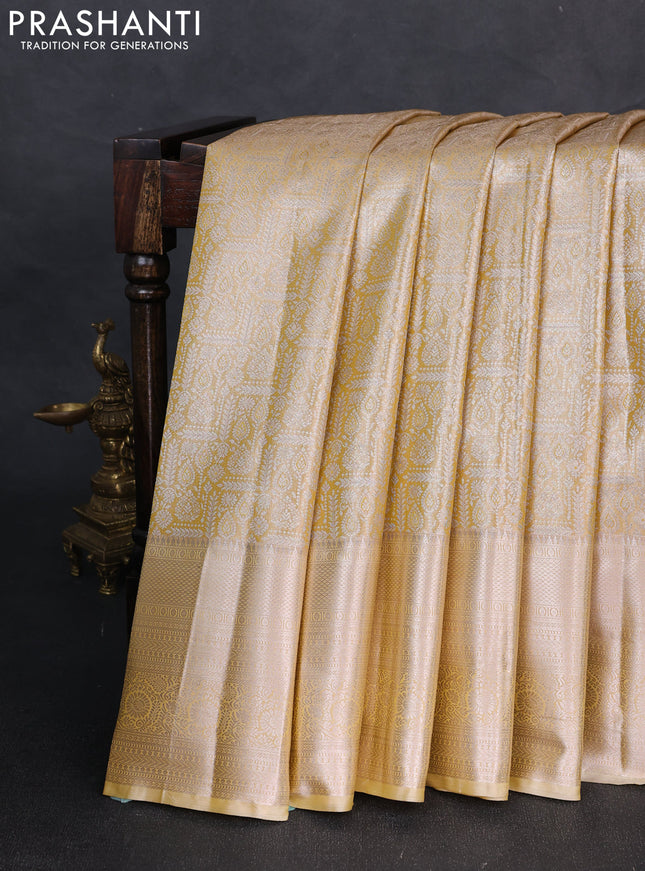 Bangalori tissue silk saree mustard yellow and pale yellow with allover zari woven brocade weaves and long zari woven border