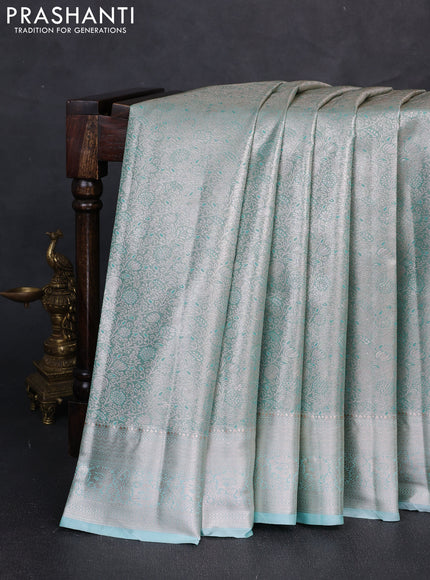 Bangalori tissue silk saree teal green with allover zari woven brocade weaves and zari woven border