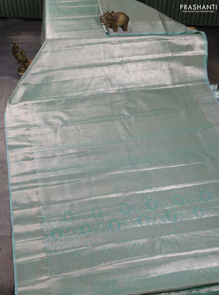 Bangalori tissue silk saree teal green with allover zari woven brocade weaves and zari woven border