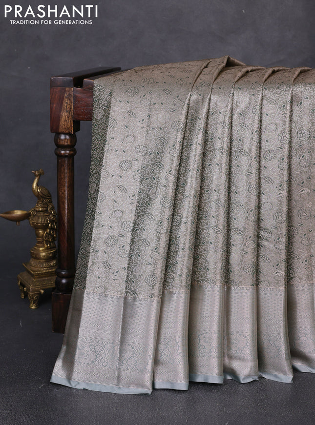 Bangalori tissue silk saree pastel green with allover zari woven brocade weaves and long zari woven border