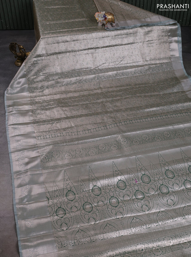 Bangalori tissue silk saree pastel green with allover zari woven brocade weaves and long zari woven border