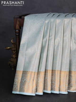 Bangalori tissue silk saree teal green with allover zari woven brocade weaves and zari woven border