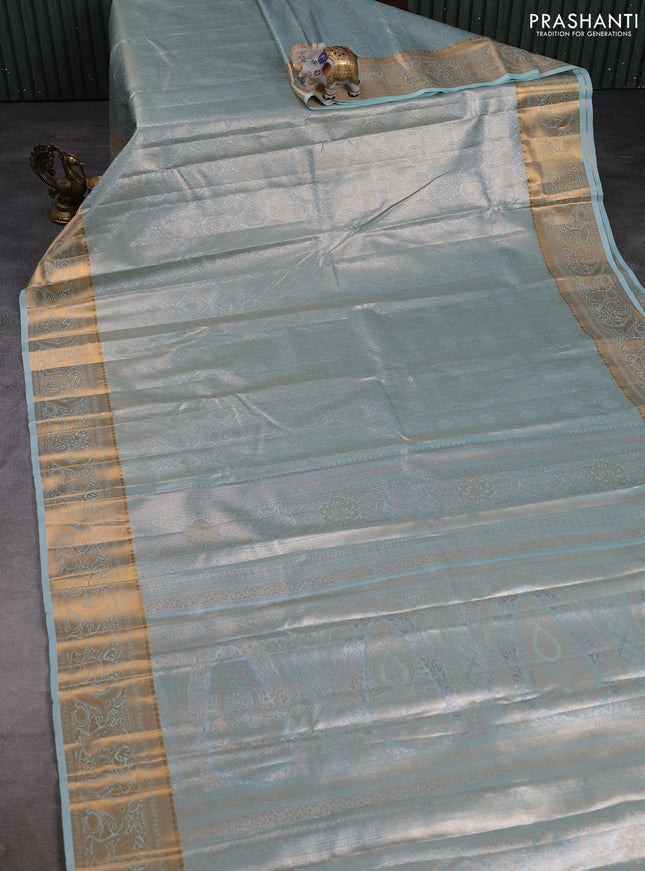 Bangalori tissue silk saree teal green with allover zari woven brocade weaves and zari woven border