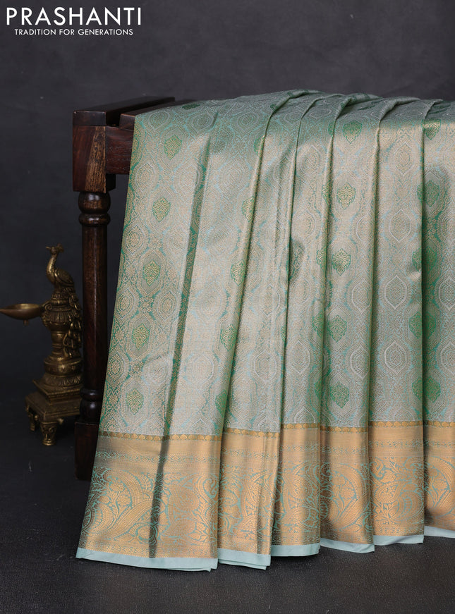 Bangalori tissue silk saree teal green with allover zari woven brocade weaves and zari woven border