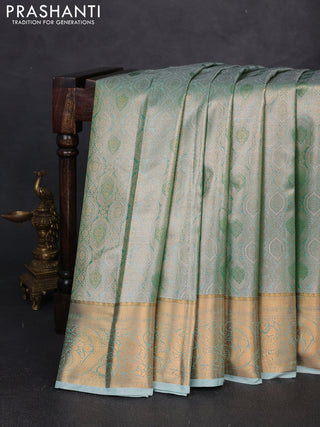 Bangalori tissue silk saree teal green with allover zari woven brocade weaves and zari woven border