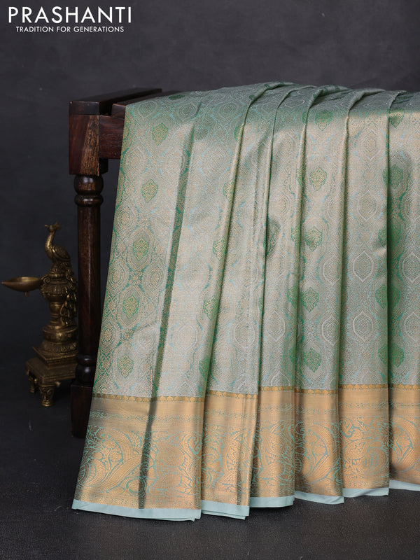 Bangalori tissue silk saree teal green with allover zari woven brocade weaves and zari woven border
