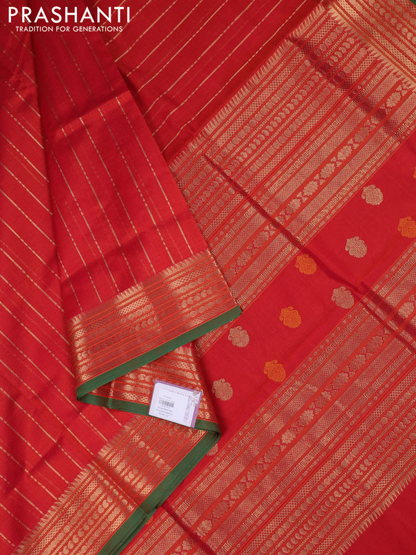 Kanchipuram silk cotton saree dual shade of rustic orange and green with allover zari weaves and zari woven border