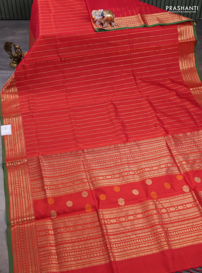 Kanchipuram silk cotton saree dual shade of rustic orange and green with allover zari weaves and zari woven border