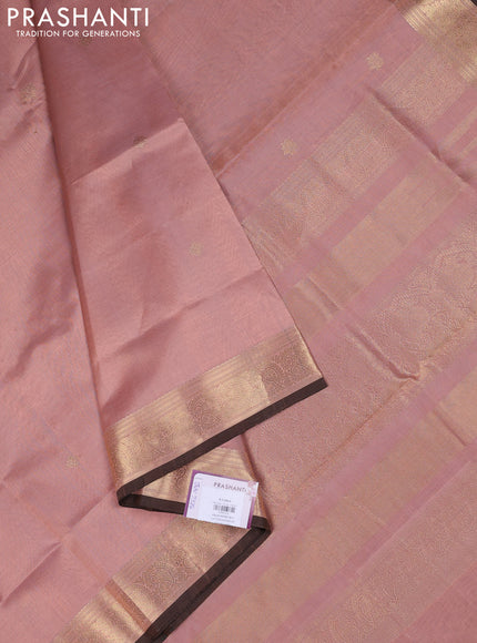 Kanchipuram silk cotton saree pastel peach and brown with plain body and zari woven border