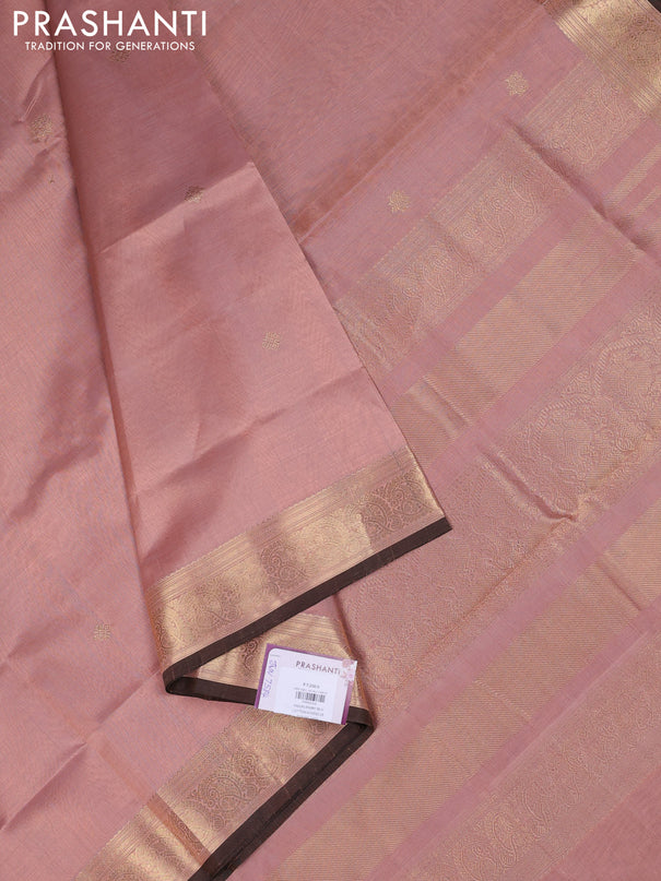 Kanchipuram silk cotton saree pastel peach and brown with plain body and zari woven border