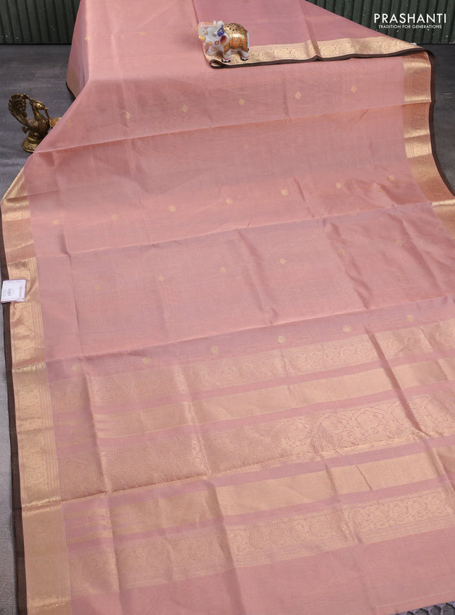 Kanchipuram silk cotton saree pastel peach and brown with plain body and zari woven border