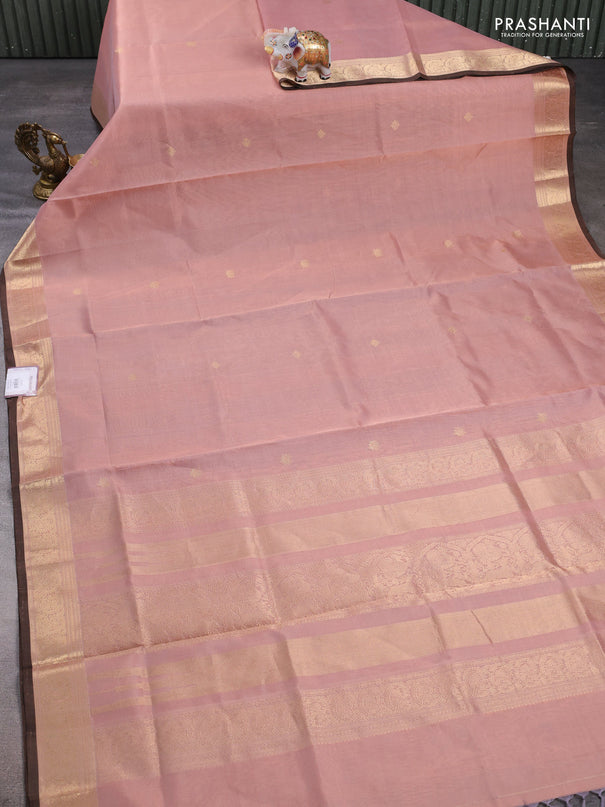 Kanchipuram silk cotton saree pastel peach and brown with plain body and zari woven border