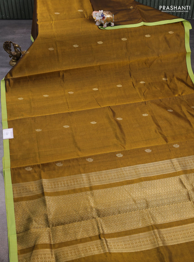 Kanchipuram silk cotton saree dark mustard and pista green with annam zari woven buttas and piping border