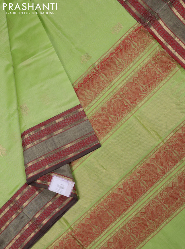 Kanchipuram silk cotton saree pista green and brown with zari woven buttas and rettapet zari woven border