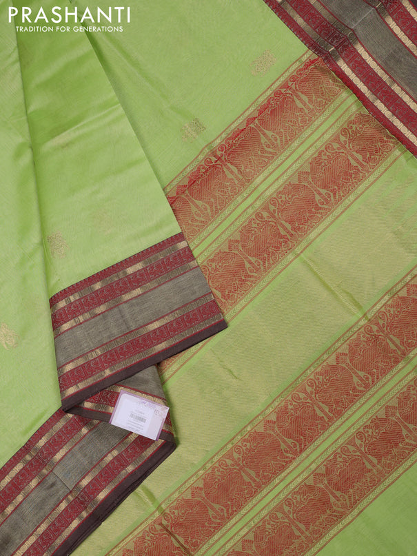 Kanchipuram silk cotton saree pista green and brown with zari woven buttas and rettapet zari woven border