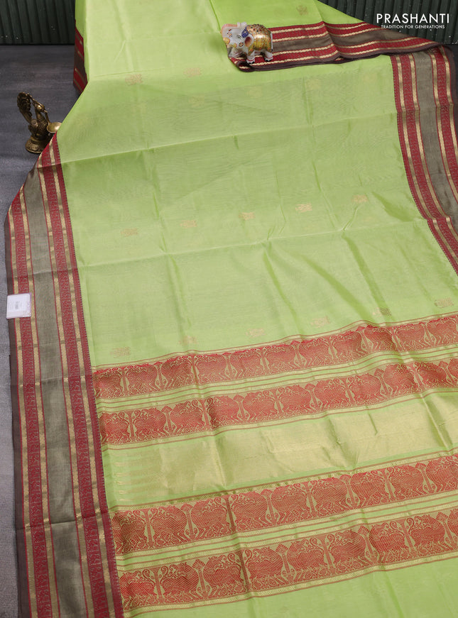 Kanchipuram silk cotton saree pista green and brown with zari woven buttas and rettapet zari woven border