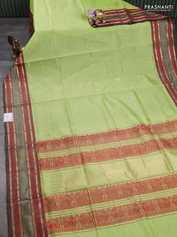 Kanchipuram silk cotton saree pista green and brown with zari woven buttas and rettapet zari woven border