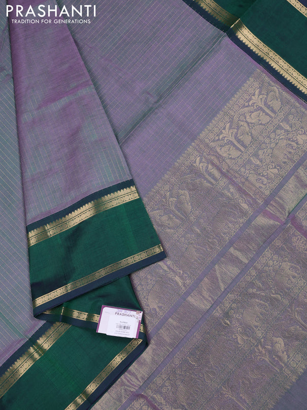 Kanchipuram silk cotton saree dual shade of greenish lavender and dual shade of dark green with allover zari stripe pattern and rettapet zari woven border