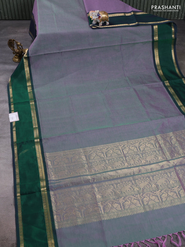 Kanchipuram silk cotton saree dual shade of greenish lavender and dual shade of dark green with allover zari stripe pattern and rettapet zari woven border