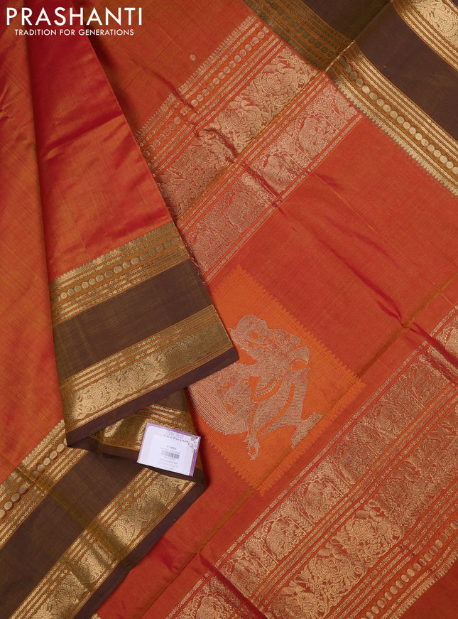 Kanchipuram silk cotton saree sunset orange and brown shade with zari woven buttas and zari woven border