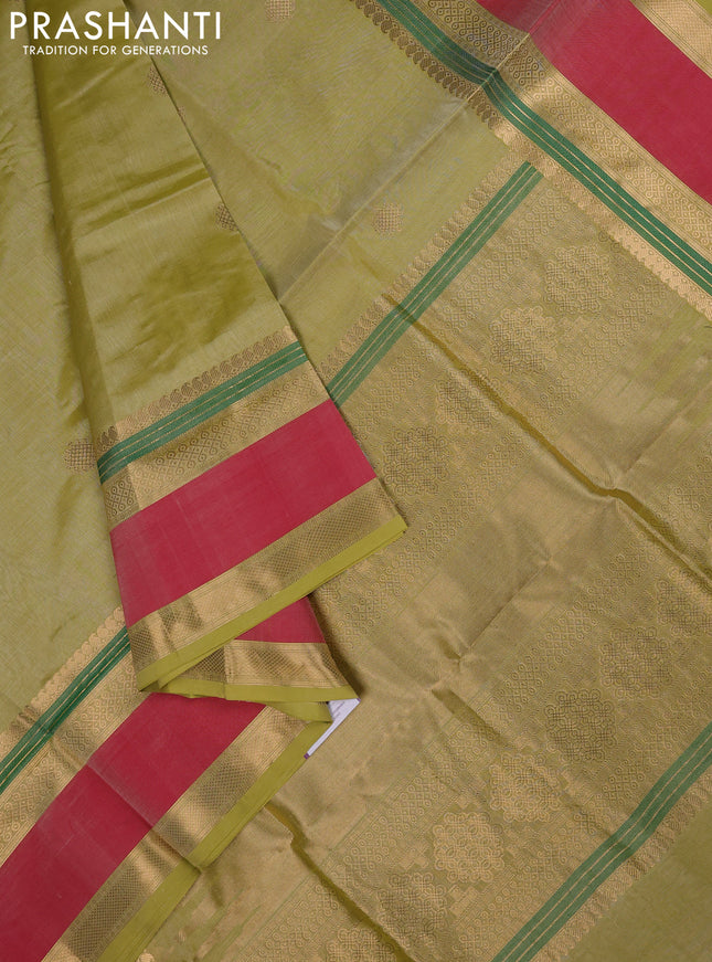 Kanchipuram silk cotton saree pista green and red with zari woven rangoli buttas and rettapet zari woven border