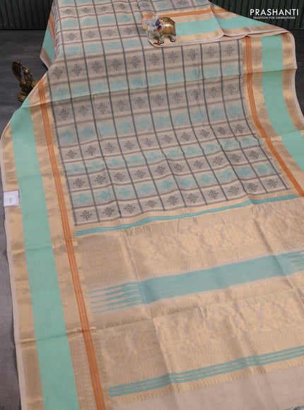 Kanchipuram silk cotton saree cream and teal blue with allover thread checks & rangoli buttas and rettapet zari woven border
