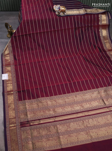 Kanchipuram silk cotton saree dual shade of wine shade with allover thread stripe pattern and zari woven border