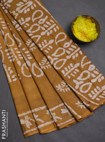 Batik cotton saree mustard yellow with allover prints and batik printed border