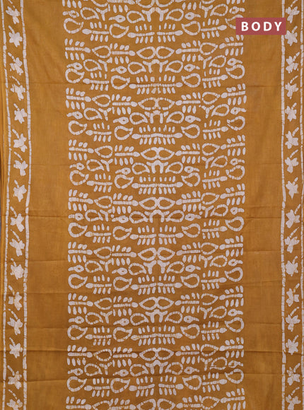 Batik cotton saree mustard yellow with allover prints and batik printed border