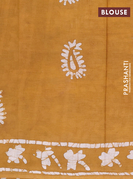 Batik cotton saree mustard yellow with allover prints and batik printed border