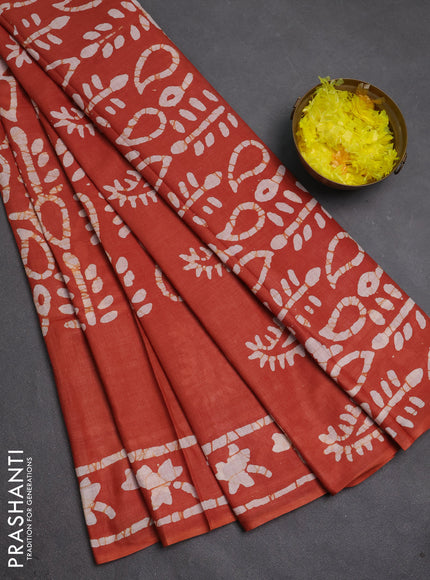 Batik cotton saree rust shade with allover prints and batik printed border