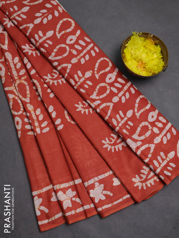 Batik cotton saree rust shade with allover prints and batik printed border