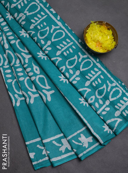 Batik cotton saree teal green with allover prints and batik printed border