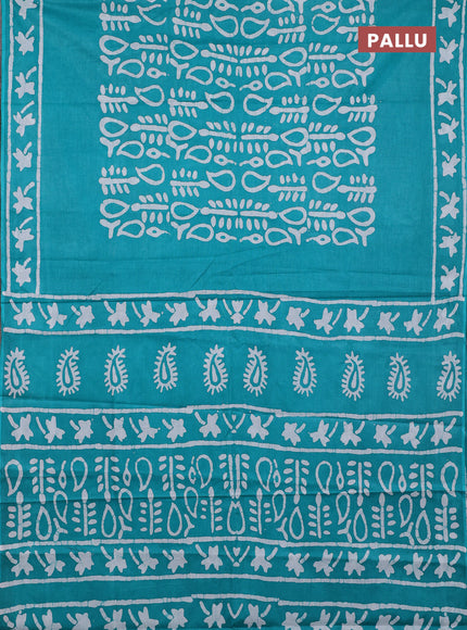Batik cotton saree teal green with allover prints and batik printed border