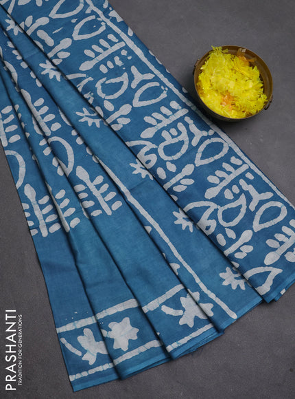 Batik cotton saree peacock blue with allover prints and batik printed border