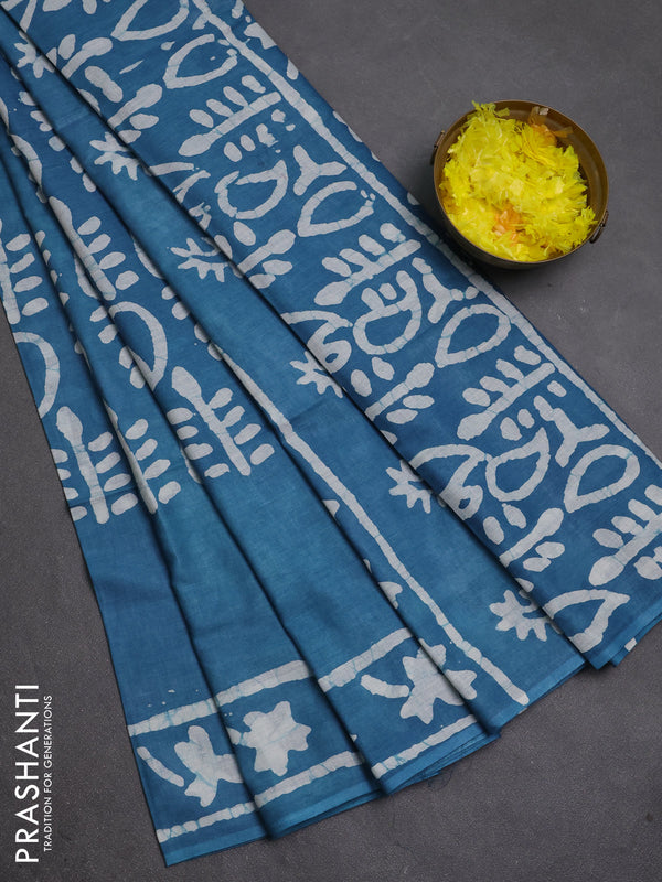 Batik cotton saree peacock blue with allover prints and batik printed border
