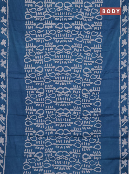 Batik cotton saree peacock blue with allover prints and batik printed border