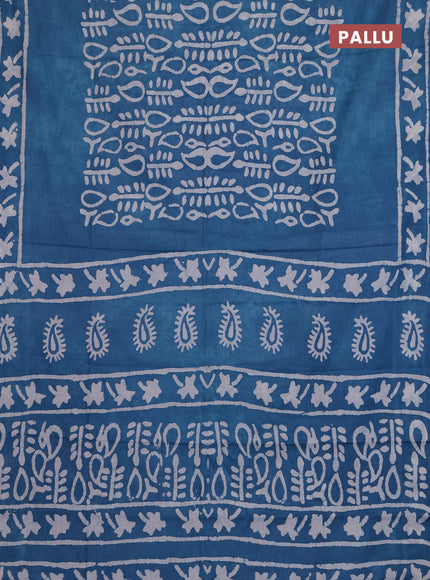 Batik cotton saree peacock blue with allover prints and batik printed border