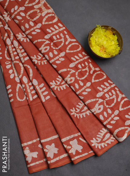 Batik cotton saree rustic orange with allover prints and batik printed border