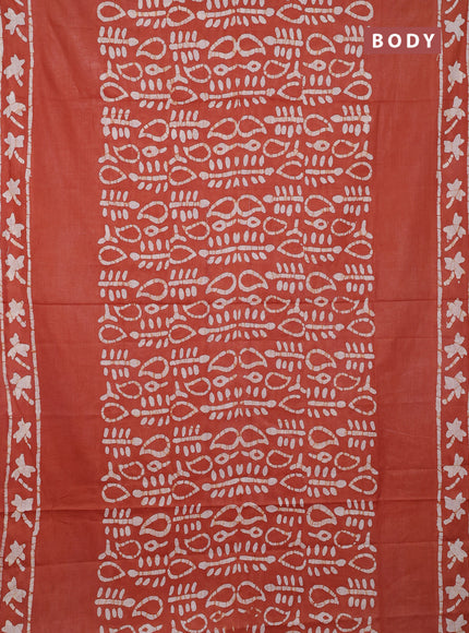 Batik cotton saree rustic orange with allover prints and batik printed border