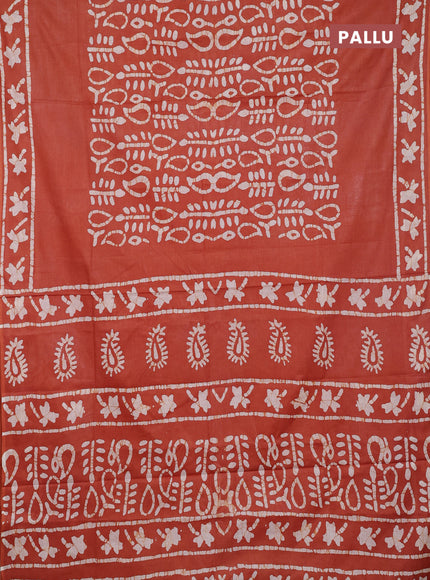 Batik cotton saree rustic orange with allover prints and batik printed border