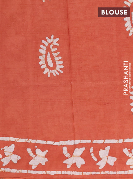Batik cotton saree rustic orange with allover prints and batik printed border