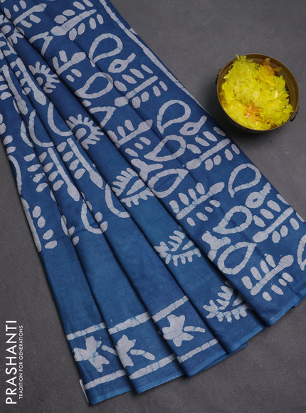 Batik cotton saree peacock blue with allover prints and batik printed border