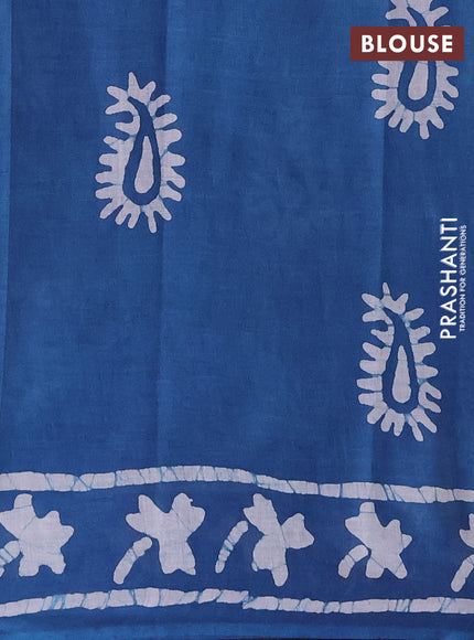 Batik cotton saree peacock blue with allover prints and batik printed border