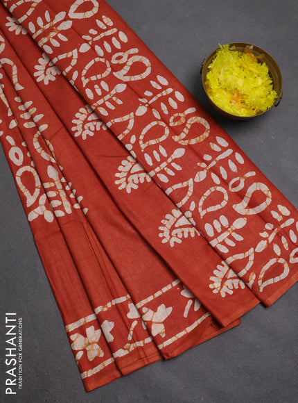 Batik cotton saree rustic orange with allover prints and batik printed border