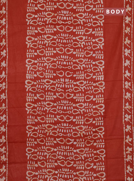 Batik cotton saree rustic orange with allover prints and batik printed border